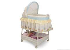 Delta Children Disney Nutopia Gliding Bassinet, Side View a1a