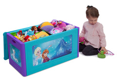 Delta Children Frozen Blow Molded Toy Box Right Side View with Props and Model a5a